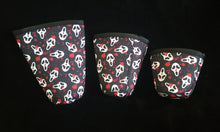 Load image into Gallery viewer, A set of three cup sleeves, in various sizes with the Valloscream pattern.