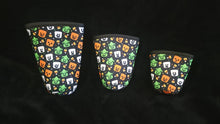 Load image into Gallery viewer, A set of three cup sleeves, in various sizes with the boo buckets pattern.