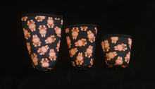 Load image into Gallery viewer, A set of three cup sleeves, in various sizes with the pumpkin labubu pattern.