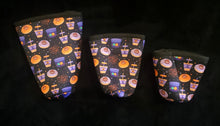 Load image into Gallery viewer, A set of three cup sleeves, in various sizes with the dunkin pattern.