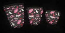 Load image into Gallery viewer, A set of three cup sleeves, in various sizes with the mean ghouls pattern.