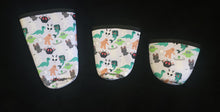 Load image into Gallery viewer, A set of three cup sleeves, in various sizes with the cryptids pattern.