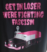Load image into Gallery viewer, Black shirt with pink text reading, "Get in Loser, We're Fighting Fascism." An ode to Mean Girls. Image shows a ponk hearse with two skeletons.