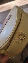 Load image into Gallery viewer, A close up of a damaged bag.