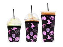 Load image into Gallery viewer, A set of three cup sleeves, in various sizes, with the witchy pink pattern.