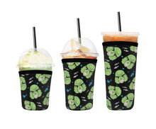 Load image into Gallery viewer, A set of three cup sleeves, in various sizes with the creature pattern.