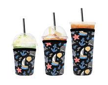 Load image into Gallery viewer, A set of three cup sleeves, in various sizes with the spook-sea pattern.