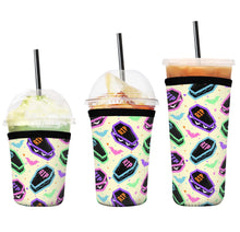 Load image into Gallery viewer, A set of three cup sleeves, in various sizes with the funfetti coffin cakes pattern.