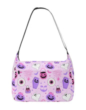 Load image into Gallery viewer, Mock-up of the Everyday, Everything bag in the pasteloween pattern. This is a canvas tote bag, with a zipper opening, front zipper pocket, and 2 side pockets.