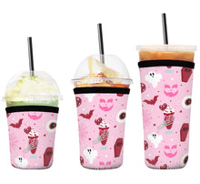 Load image into Gallery viewer, A set of three cup sleeves, in various sizes with the red velvet pink pattern.