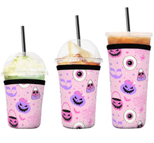 Load image into Gallery viewer, A set of three cup sleeves, in various sizes with the pasteloween pattern.