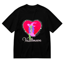 Load image into Gallery viewer, Black tee with a heart-shaped graphic featuring a cutesy green witch, with purple hair, a pink spiderweb witch hat and dress sitting in the heart. 'Valloween' text in white is below the graphic.