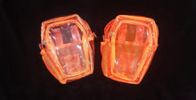 Load image into Gallery viewer, Clear coffin concert bag with orange accents next to a translucent orange coffin bag with orange accents.
