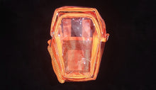 Load image into Gallery viewer, A clear orange coffin-shaped concert bag with zipper pocket, water net, slip pocket inside, featuring two adjustable straps for different carrying options.
