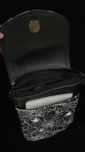 Load image into Gallery viewer, Top view of opened cell phone bag with spider web design on a black background
