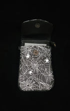Load image into Gallery viewer, Opened cell phone bag with spider web design on a black background
