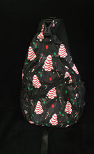 Load image into Gallery viewer, The sling bag in the little deb pattern is a poly/twill bag, with 2 zipper pockets, 2 slip  pockets, and 2 side netting pockets.
