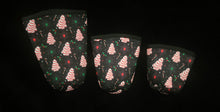Load image into Gallery viewer, A set of three cup sleeves, in various sizes with the little deb pattern.
