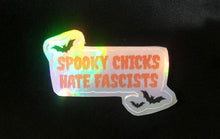 Load image into Gallery viewer, Holographic sticker with 'Spooky Chicks Hate Fascists' text
