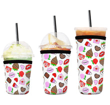 Load image into Gallery viewer, A set of three cup sleeves, in various sizes with the valloween icons pattern.
