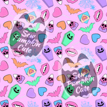 Load image into Gallery viewer, Colorful pastel Halloween and Valentines-themed pattern on a pink background with candy, bats, coffins, and ghost designs.
