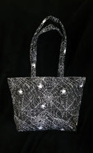 Load image into Gallery viewer, Black tote bag with white spider web pattern

