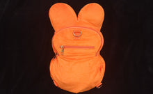 Load image into Gallery viewer, Back side of plush Trick R Treat backpack featuring two zippers.
